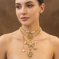 Collier pendentif océan en acier inoxydable plaqué or 18 carats pour femmes JUSNOVA |   Bijoux anti-ternissement étanches en perles et zircons en forme d'étoile de mer