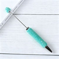 Nouveau stylo rotatif en plastique couleur bonbon entièrement orné de strass, stylo bille DIY en argile et strass, stylo fluorescent 106 très populaire