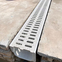 Caniveau de drainage en béton polymère haute résistance U150 avec grille en fonte pour voie publique extérieure classe de charge D400