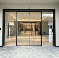 Porte coulissante automatique à double battant avec capteur et verre trempé pour passage sans contact, idéale pour les bureaux, hôtels et centres commerciaux