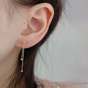 Xinfly Simple Fashion Bow Tassel Earrings 18K Gold Lace Plain AU750 Earrings for Women for Parties and Trendy Style - Product Image 5