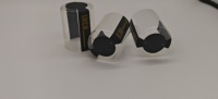 Capsules thermorétractables personnalisées en PVC transparent à pois avec languette d'ouverture dorée pour le scellage des cols de bouteilles et de pots