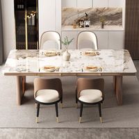 Table à manger minimaliste italienne en métal brillant de luxe léger, design moderne pour 8 personnes ; Table à manger rectangulaire style villa avec plateau en marbre