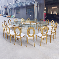 Table de mariage de luxe ronde en acier inoxydable doré avec plateau en verre miroir pour la décoration de la table de mariage