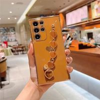Coque de téléphone élégante avec bracelet plaqué cœur pour Samsung S26 S25 S24 Ultra Plus S21 Plus A57 A52 A53 A16 A13 A12 5G