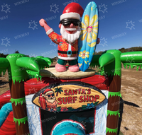 Château gonflable commercial de Noël avec toboggan, thème Père Noël, pour location événementielle