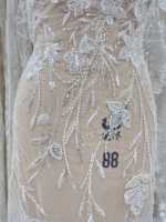 Tissu en dentelle blanche à sequins et perles en gros