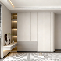 Armoire de chambre moderne personnalisée avec portes en MDF et structure en panneaux de fibres à haute densité pour le rangement et l'exposition dans le salon