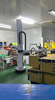 Bras robotisé de palettisation de caisses avec pince à ventouse, robot à pince à ventouse. 240 sacs/h, 25-200 kg/sac, IP52