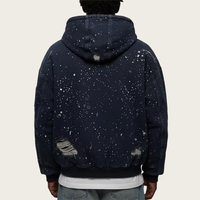 Veste streetwear en toile de coton premium 100% avec motif éclaboussures de peinture et bords effilochés, idéale pour un style urbain essentiel et un look robuste.