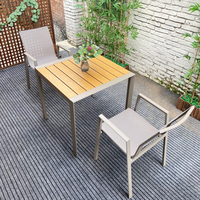 Chaise de jardin empilable en gros avec accoudoirs incurvés en aluminium, tissu textilène anti-UV et imperméable pour hôtels, villas et complexes hôteliers