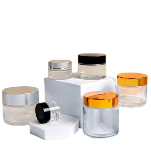 Diferentes capacidades personalizadas de tarro de contenedor de vidrio Embalaje Tapa redonda de aluminio Tarro cosmético con tapa de metal