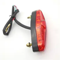 यूनिवर्सल नई डिजाइन लाल लेंस मोटरसाइकिल अंडाकार 12V एलईडी ब्रेक टेल लाइट रनिंग टेललाइट रियर सूचक दीपक सामान