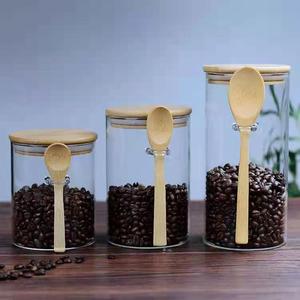 Pot de stockage en verre borosilicaté de forme ronde de diamètre 65mm 85mm 100mm avec couvercles et cuillère hermétiques en bambou pour céréales en grains de café - Product Image 5