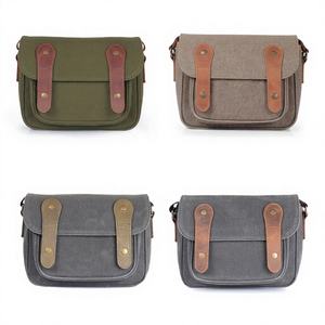 Sac à bandoulière vintage en cuir et toile de haute qualité pour appareil photo reflex numérique, étanche et antichoc, avec fermeture éclair, idéal pour les voyages et la photographie. - Product Image 1