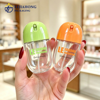 Flacon pulvérisateur ovale PET mignon de 50 ml, large couverture, buse de pulvérisation délicate, logo personnalisé imprimé en soie, flacon cosmétique portable