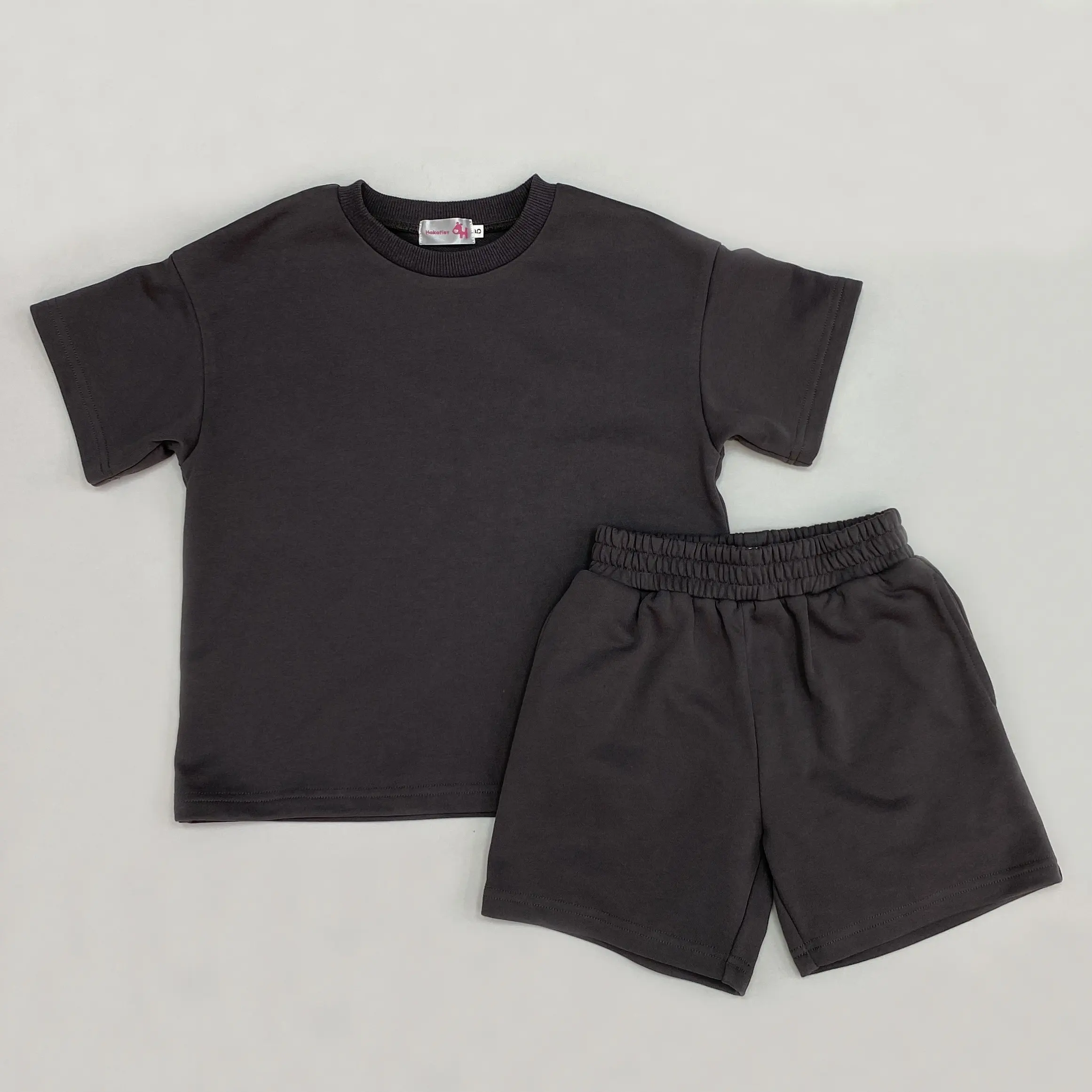 Vente en gros Ensemble décontracté pour enfants garçons et filles Ensemble unisexe t-shirt short en éponge Ensemble de vêtements d'été pour enfants