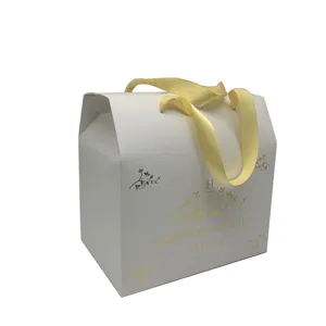 Wholesale good price white cardboard folded custom gift packaging gold foil design box with ribbon handle
