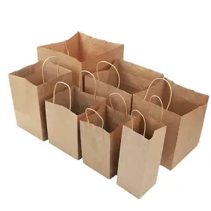 Tas kertas Kraft dengan takeaway cetak khusus kualitas tinggi dengan kemasan logo Anda sendiri dengan pegangan untuk pengiriman makanan dan hadiah