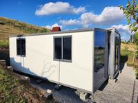 Maison extensible HUASHA de 20 pieds avec ailes en verre miroir pleine hauteur, résistance aux tremblements de terre de niveau 7 et résistance au vent de 120 km/h
