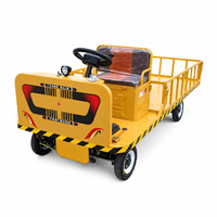 Chariot à plateau motorisé industriel avec clôture, commande au volant, camion électrique de transport de marchandises pour entrepôt, usine, logistique