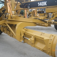 Niveleuse Caterpillar 140K d'occasion pour travaux routiers et terrassement, avec boîte de vitesses et pompe, pour la construction