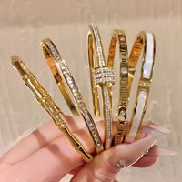 Bracelets en gros anti-décoloration plaqués or 18 carats, étanches, anti-ternissement, en titane, entièrement sertis de zircons, bijoux de mode pour femmes JianYi