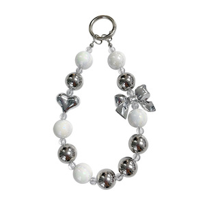 Nouveau Pendentif de téléphone en acrylique et soie, motif dessin animé, avec nœud argenté, style polyvalent, personnalisable et universel, pour coque de téléphone numérique - Product Image 1