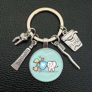 Porte-clés en métal avec pendentif en forme de fil dentaire, dentifrice, <span class=keywords><strong>brosse</strong></span> <span class=keywords><strong>à</strong></span> dents, cabochon en verre, cadeau <span class=keywords><strong>pour</strong></span> dentiste, assistant dentaire, soins <span class=keywords><strong>dentaires</strong></span> - Product Image 4
