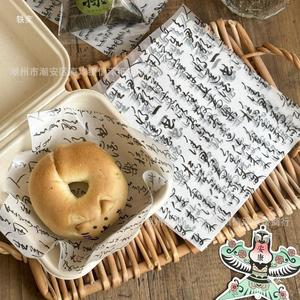 กระดาษพาร์เชิ้นท์ลายอักษรวิจิตร 18x18 ซม. เกรดอาหาร ป้องกันน้ำมัน สำหรับบรรจุภัณฑ์เบเกอรี่ ชีสเค้ก แซนวิช เบอร์เกอร์ แบบใช้แล้วทิ้ง - Product Image 4