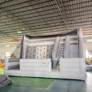 Structure gonflable blanche et grise avec mur d'escalade et toboggan, château gonflable pour fête - Product Image 1