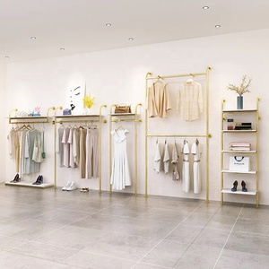 Listo para enviar, estante de ropa de Metal bonito a la moda, estante de ropa montado en la pared dorado de acero inoxidable para exhibición de <span class=keywords><strong>tienda</strong></span> de mujeres Boutique - Product Image 6
