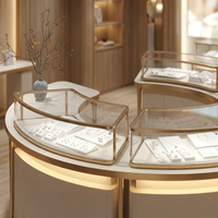 Vitrine d'îlot pour bijoux, ronde et incurvée, avec cadre doré champagne et éclairage LED, pour magasin de diamants