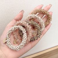 2025 Ins accessoires de cheveux les plus populaires décoratifs cristal élastique perle cheveux cravates Bracelets pour femmes filles