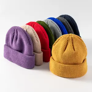 Cappelli invernali lavorati a maglia spessa del berretto acrilico del pescatore piegato modo Unisex all'ingrosso di alta qualità con il berretto su ordinazione della toppa del ricamo