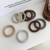En gros, élastiques à cheveux métalliques brillants en spirale, attaches pour queue de cheval, bracelets pour femmes et filles