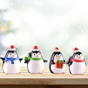 Joyeux Noël Miniature <span class=keywords><strong>de</strong></span> pingouin tenant une boîte cadeau Jolie figurine <span class=keywords><strong>de</strong></span> pingouin Parfait pour la décoration intérieure des fêtes - Product Image 1
