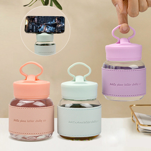 Bouteille d'<span class=keywords><strong>eau</strong></span> portable 300ml Mini tasse à <span class=keywords><strong>eau</strong></span> Support pour téléphone portable Tasse en verre avec <span class=keywords><strong>gaine</strong></span> en cuir - Product Image 1
