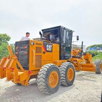 Niveleuse Caterpillar 140 d'occasion, 20 tonnes, pour travaux routiers, avec ripper