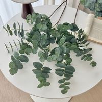 Vente en gros de feuilles d'eucalyptus artificielles en soie à longues tiges, branche unique pour arrangements floraux DIY, verdure artificielle au toucher réel