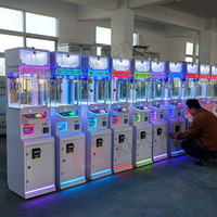 Máquina de garras comercial Mega Mini operada con monedas para centros comerciales y salas de juegos