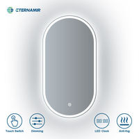 Miroir de courtoisie LED ovale de style moderne Appliques murales décoratives en gros Miroir LED encadré illuminé par écran tactile
