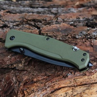 Couteau de poche tactique pliant multi-usages en acier inoxydable noir OEM pour le camping et la survie avec manche G10