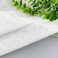 Rollo de tela de algodón blanco puro de alta calidad personalizado tela bordada con ojales para vestido de niñas