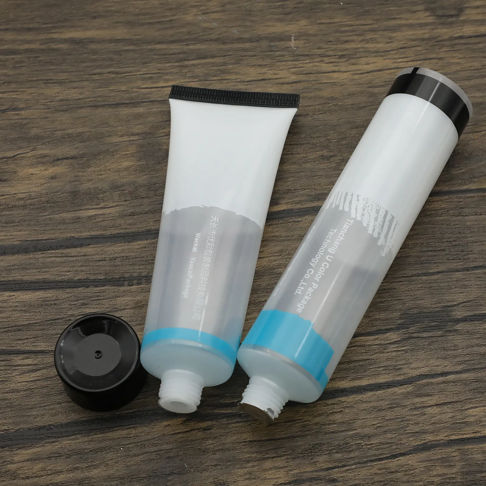 Venta al por mayor vacío 50ml plástico transparente PE cosmético apretar impresión tubo de plástico suave con tapas