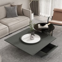 Table basse de salon moderne en marbre flottant durable en forme de triangle inversé italien avec plateau tournant carré