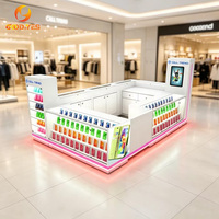 Elegante Exhibidor para Tienda de Celulares con Placa Trasera Retroiluminada en Rosa y Diseño de Kiosco para Reparación de Teléfonos Móviles