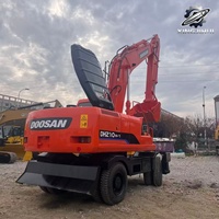 Vente Flash : Excavatrice sur pneus Doosan DH210 d'occasion, 21 tonnes, système hydraulique complet, bon état, livraison rapide, expédition mondiale