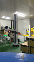 Bras robotisé de palettisation de caisses avec pince à ventouse, robot à pince à ventouse. 240 sacs/h, 25-200 kg/sac, IP52