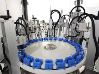 Machine automatique de sertissage et de collogation de capuchons de parfum à commande PLC